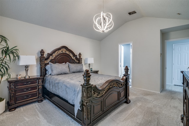 carpeted bedroom with vaulted ceiling, a textured ceiling, and a notable chandelier