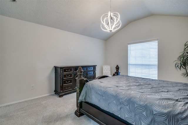 carpeted bedroom featuring vaulted ceiling, a textured ceiling, and a notable chandelier