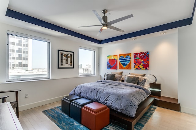 bedroom featuring light hardwood / wood-style flooring and ceiling fan