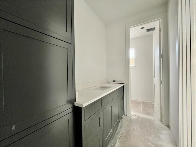 bathroom featuring concrete flooring and vanity