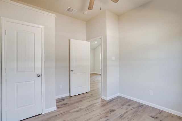 unfurnished bedroom with light hardwood / wood-style floors and ceiling fan