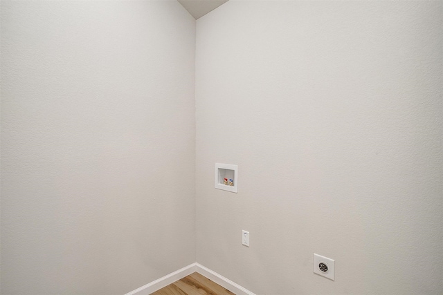 laundry room with hookup for a washing machine, hardwood / wood-style floors, and hookup for an electric dryer