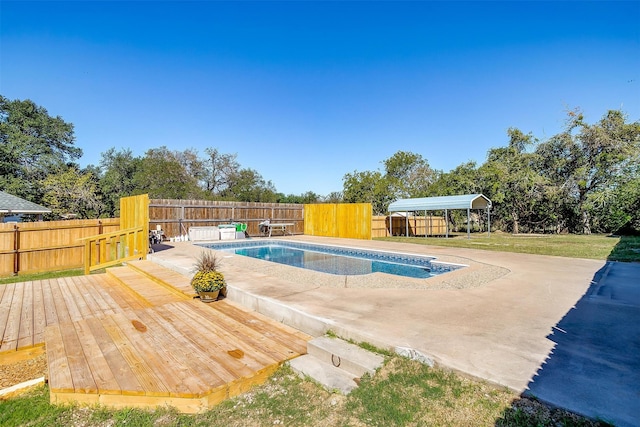 view of pool with a deck and a patio