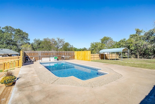 view of pool with a lawn and a patio area