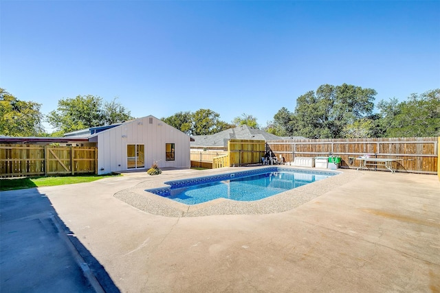 view of swimming pool featuring a patio area