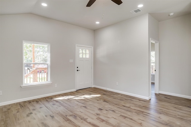 entrance foyer featuring lofted ceiling, ceiling fan, and light hardwood / wood-style flooring