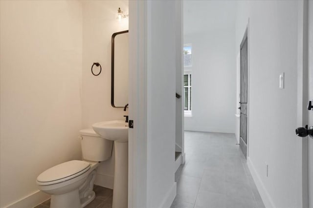 bathroom featuring tile patterned floors and toilet