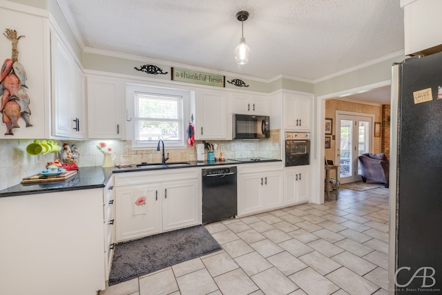 kitchen featuring black appliances, pendant lighting, ornamental molding, and decorative backsplash