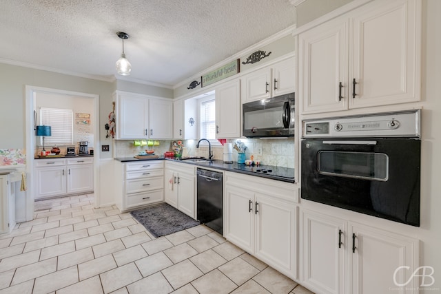 kitchen featuring pendant lighting, crown molding, white cabinetry, black appliances, and sink