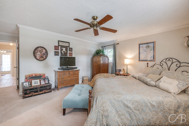 carpeted bedroom with multiple windows, ceiling fan, and a textured ceiling