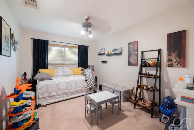 carpeted bedroom featuring ceiling fan