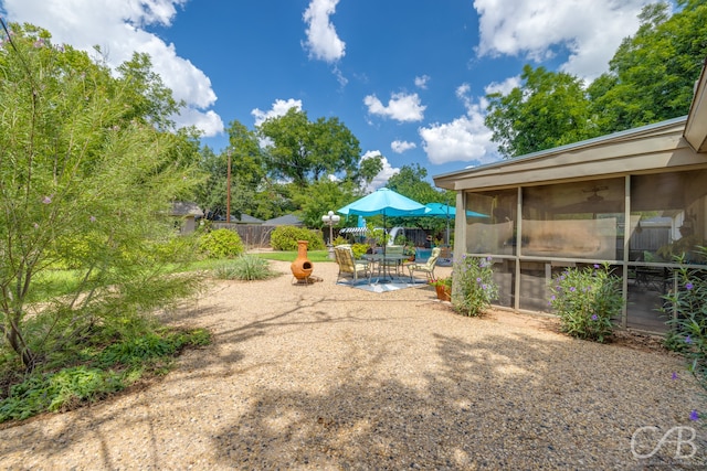 view of yard with a patio area and a sunroom