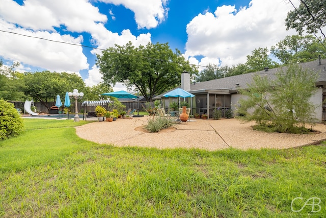 view of yard with a patio area and a sunroom