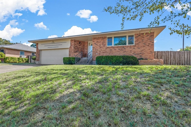 ranch-style house with a front lawn and a garage