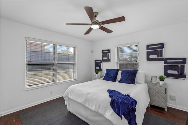 bedroom featuring ceiling fan and dark hardwood / wood-style flooring