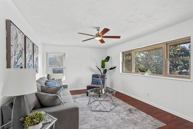 living room with ceiling fan, wood-type flooring, and plenty of natural light