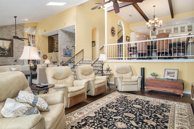 living room with ceiling fan with notable chandelier, dark hardwood / wood-style flooring, beamed ceiling, and high vaulted ceiling