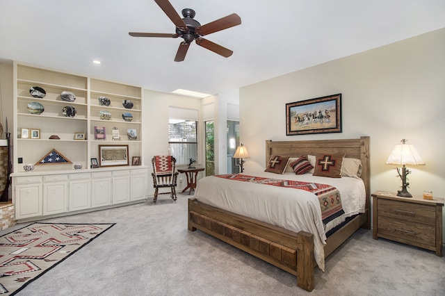 bedroom featuring ceiling fan and light colored carpet