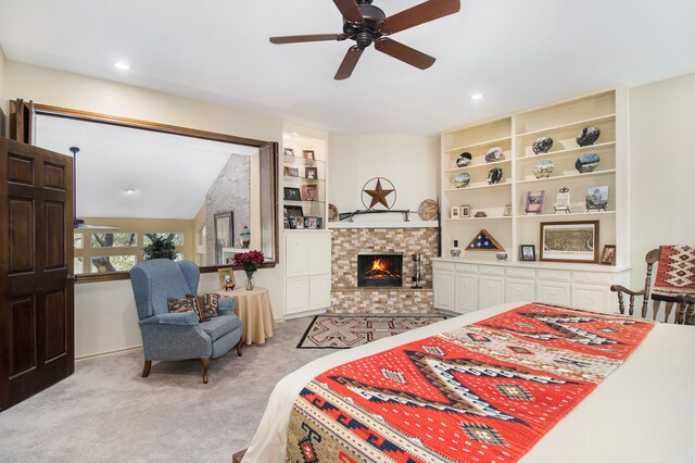 bedroom with lofted ceiling, ceiling fan, and light colored carpet