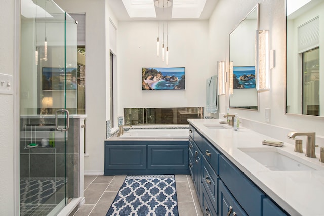 bathroom with tile patterned flooring, vanity, a skylight, and plus walk in shower