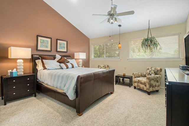 bedroom with ceiling fan, light carpet, and vaulted ceiling