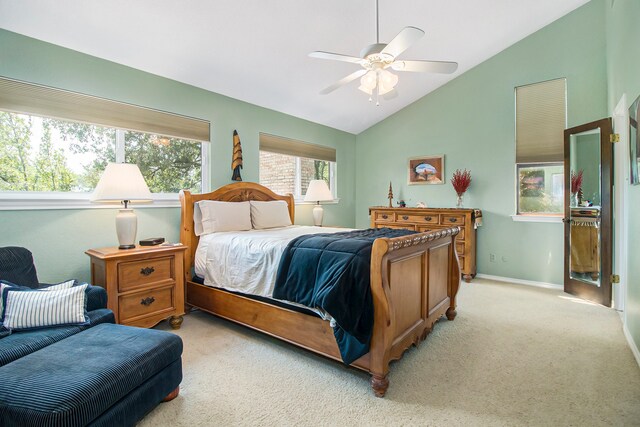 bedroom with light carpet, vaulted ceiling, and ceiling fan