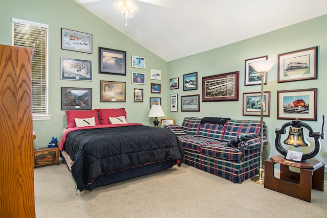 bedroom with vaulted ceiling, light carpet, and ceiling fan