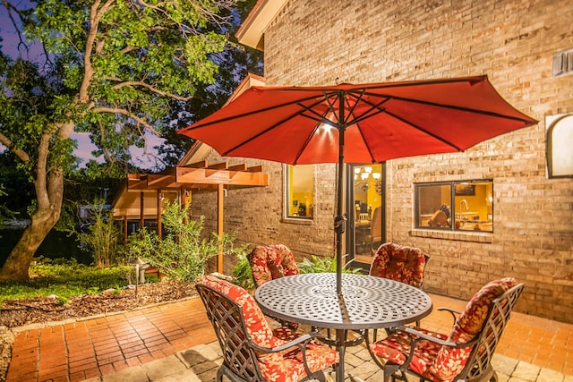 view of patio terrace at dusk