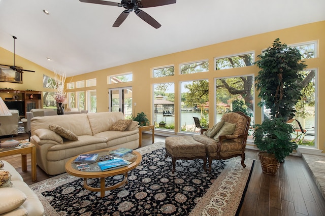 living room with ceiling fan, dark wood-type flooring, high vaulted ceiling, and a wealth of natural light