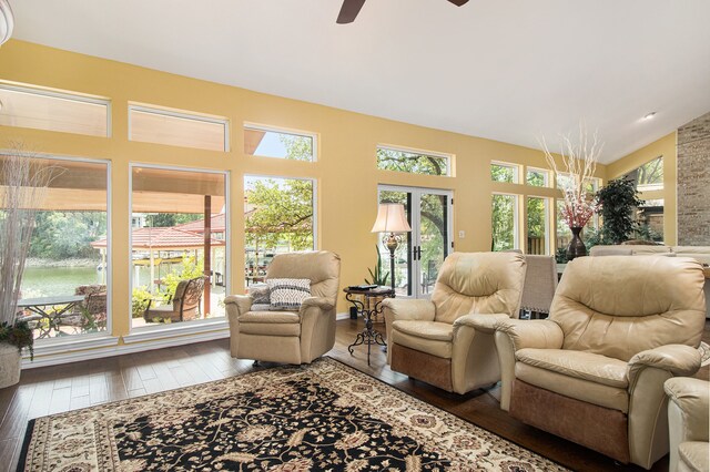 sunroom featuring vaulted ceiling, ceiling fan, and french doors