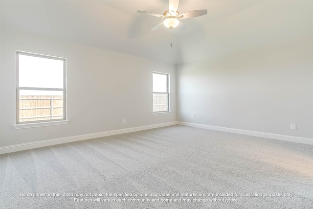 spare room featuring ceiling fan, lofted ceiling, and carpet flooring