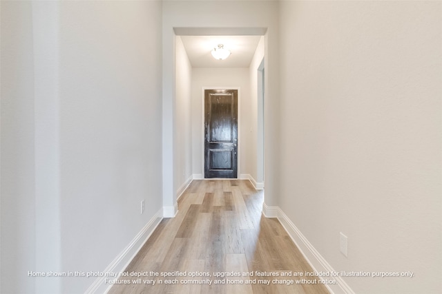 corridor with light wood-type flooring