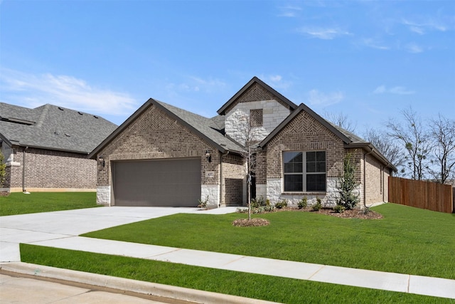 french country inspired facade with fence, concrete driveway, a front lawn, a garage, and brick siding