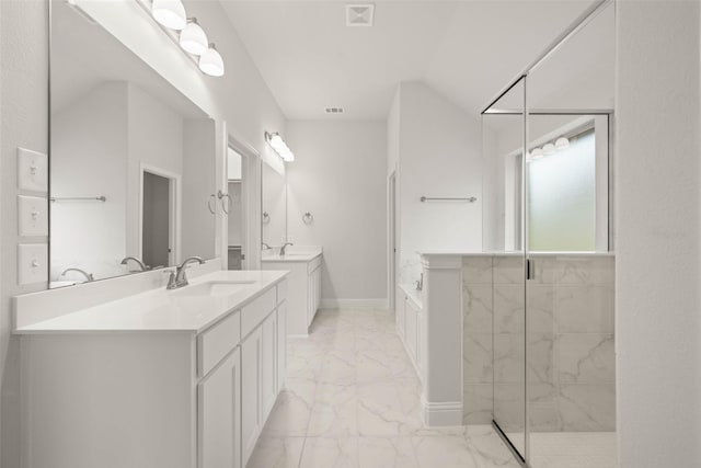 bathroom with visible vents, two vanities, a tile shower, marble finish floor, and a sink