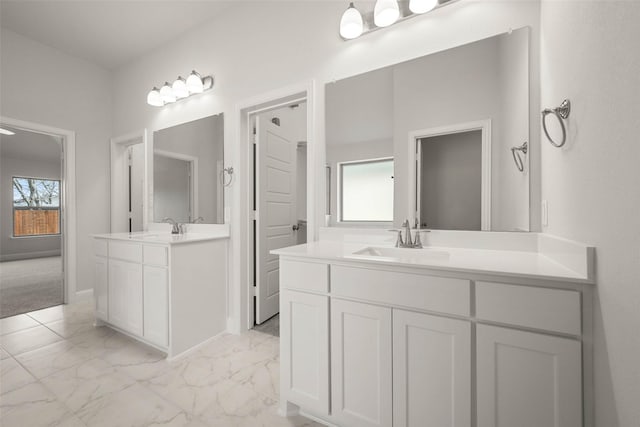 full bathroom with a sink, two vanities, and marble finish floor