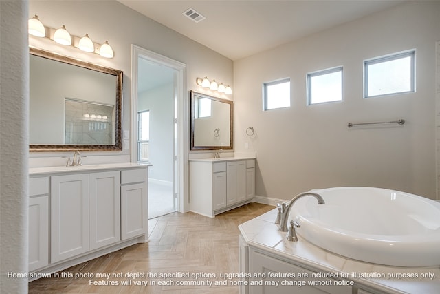 bathroom featuring two vanities, a sink, visible vents, and a bath