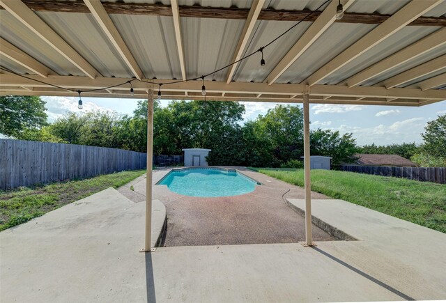 view of swimming pool with a patio area