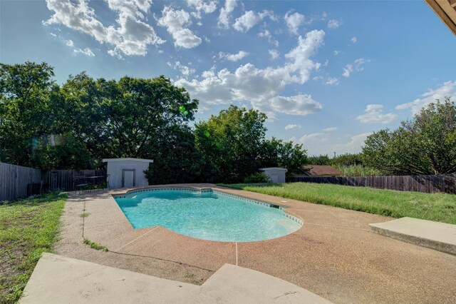 view of pool featuring an outdoor structure and a patio