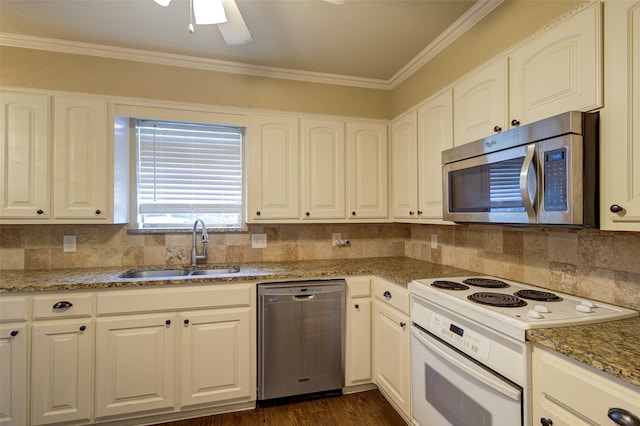 kitchen featuring stone countertops, appliances with stainless steel finishes, sink, ceiling fan, and white cabinets