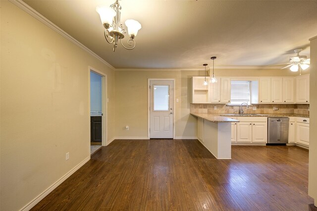 kitchen with ceiling fan with notable chandelier, dishwasher, kitchen peninsula, dark hardwood / wood-style floors, and white cabinets