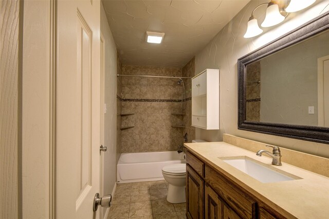 full bathroom with tiled shower / bath combo, vanity, toilet, and tile patterned floors