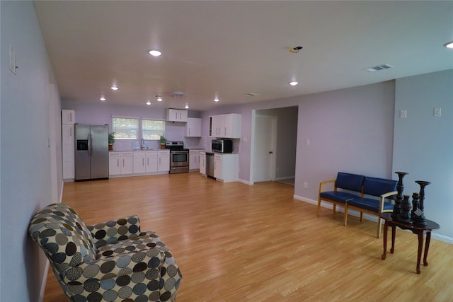 sitting room with light wood-type flooring