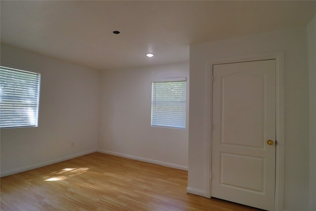 unfurnished room featuring light hardwood / wood-style floors