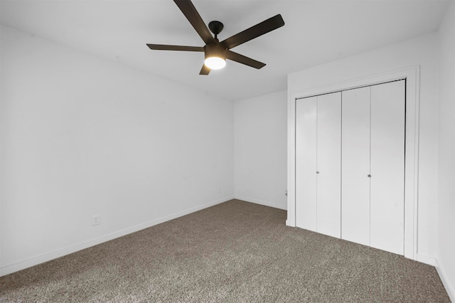 unfurnished bedroom featuring carpet flooring, a closet, and ceiling fan