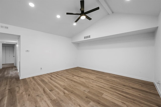 spare room featuring high vaulted ceiling, hardwood / wood-style floors, ceiling fan, and beam ceiling