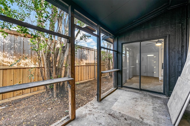 unfurnished sunroom featuring lofted ceiling