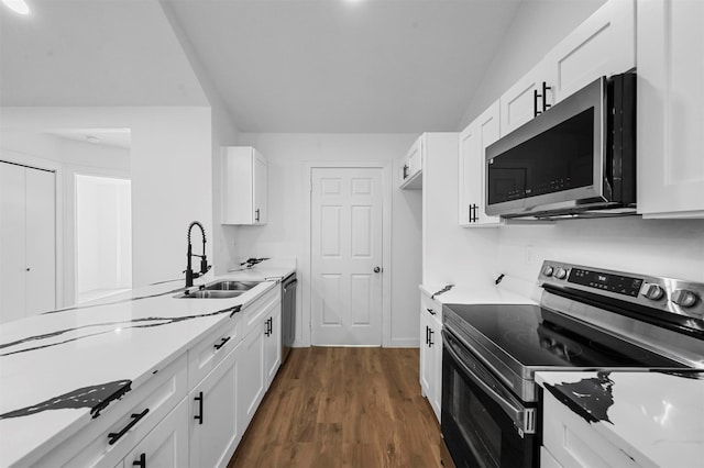 kitchen featuring stainless steel appliances, sink, and white cabinets