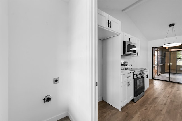 kitchen with vaulted ceiling with beams, decorative light fixtures, stainless steel appliances, dark hardwood / wood-style floors, and white cabinets