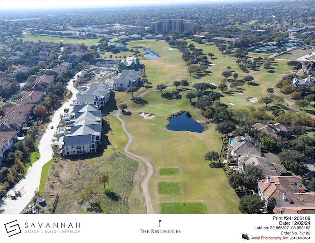 birds eye view of property with a water view, a residential view, and golf course view