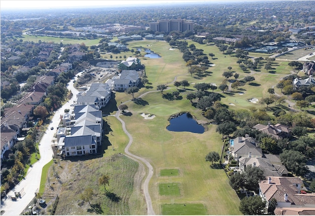 birds eye view of property with golf course view, a water view, and a residential view